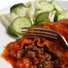 Homemade Enchilada Sauce Recipes, A red enchilada covered in sauce.