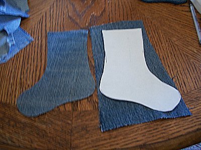 Template on one piece of denim. One cut section laying to the left.