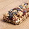 An energy bar with chocolate, dried fruit, and nuts.