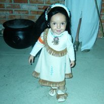 A young girl in a Pocahontas costume.