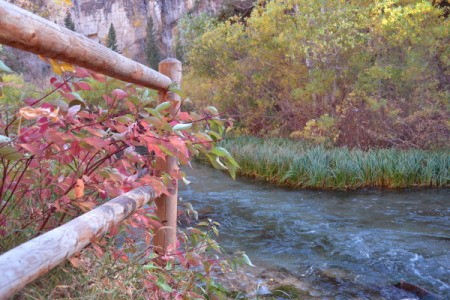 Fence in the Fall With River in Background