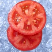 Tw Red Tomatoes sitting in Ice