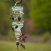 A glass hummingbird feeder.