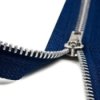 A blue zipper that is half way unzipped.