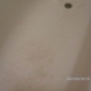 Hair dye stains in a bathtub.