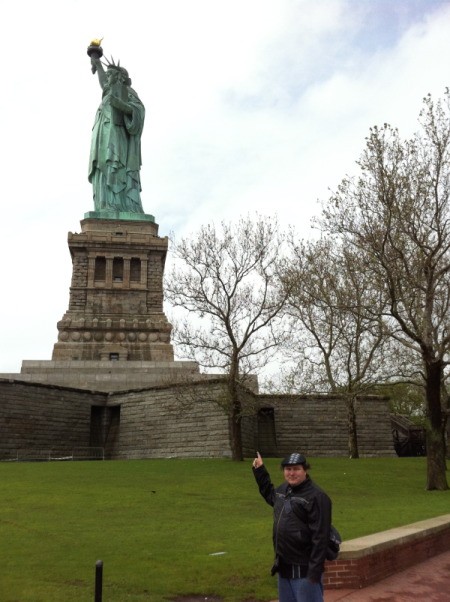 Fletcher Pointing at the Statue of Liberty