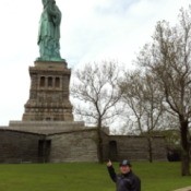 Fletcher Pointing at the Statue of Liberty