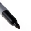 A Sharpie marker with its lid off.
