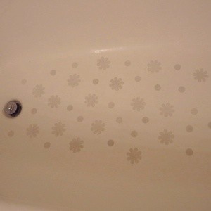 Photo of decals stuck to the bottom of a bathtub.