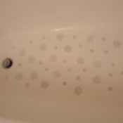 Photo of decals stuck to the bottom of a bathtub.