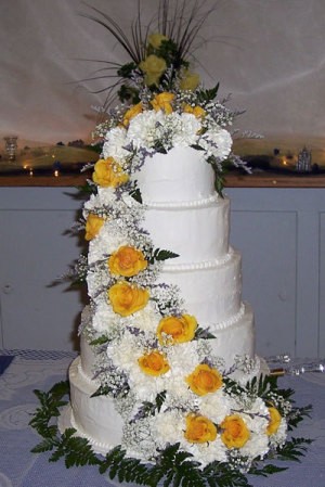 Photo of a large white wedding cake.