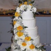 Photo of a large white wedding cake.