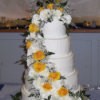 Photo of a large white wedding cake.
