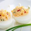 Gourmet deviled eggs, with a chive garnish.