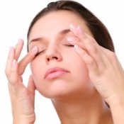 Woman massaging her eyes
