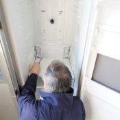 Man Repairing Refrigerator