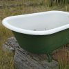 Restoring a Claw Foot Tub, An old claw foot tub outside.