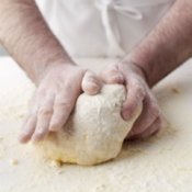 Man Kneading Pizza Dough