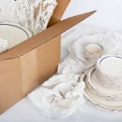 Dishes Being Packed into Box
