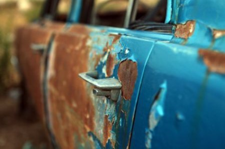 Rust and Peeling Blue Paint on Car