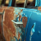 Rust and Peeling Blue Paint on Car