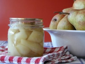 Freshly Canned Pears Near Pears in a Bowl