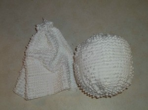 Closed chenille tube to form head and stuffed head.