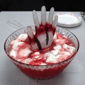 Halloween punch with a hand made of ice in the middle.