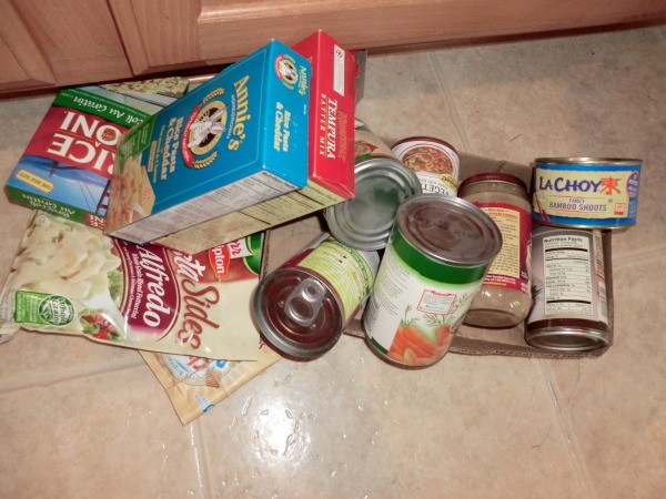 Pile of expired food from cabinet.