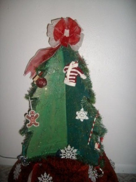 A decorative Christmas tree made of cardboard.