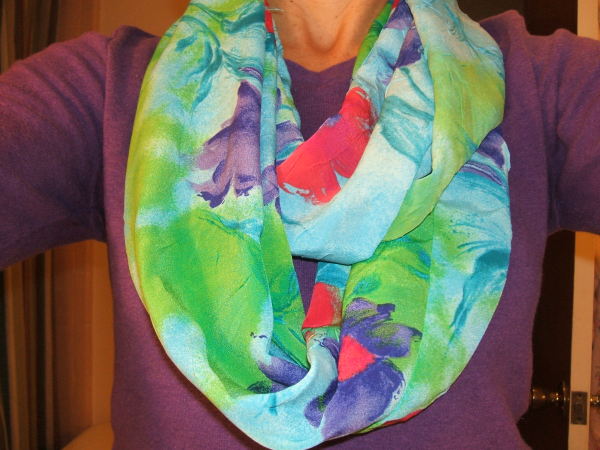 Infinity scarf, finished and around neck of creator.