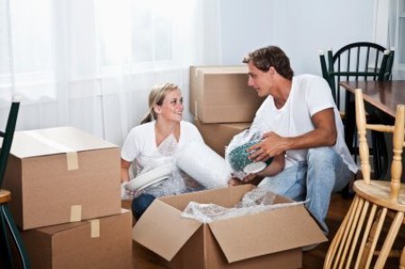 Young Couple Packing for A Move