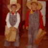 Two boys dressed up as cowboys for Halloween.