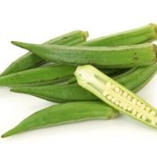 Sliced okra on pile of fresh okra