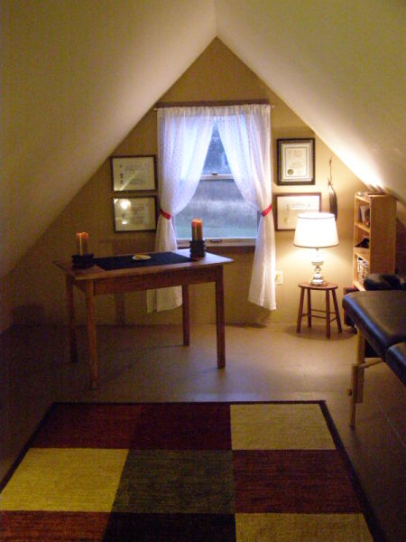 Room with a steeply pitched ceiling.