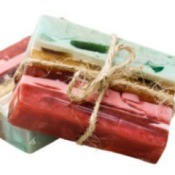 Striated homemade soap in reds, pinks, and blue.