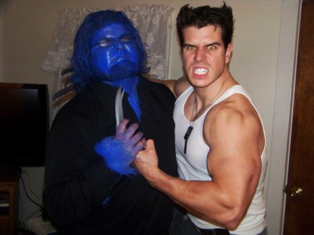 A X-Men Wolverine costume posing with a blue Beast costume.