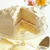 Vanilla frosting on a lemon layer cake.