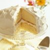 Vanilla frosting on a lemon layer cake.