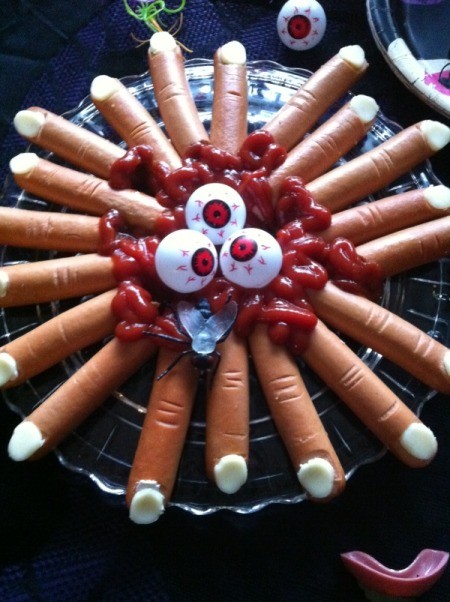A plate of hot dogs that look like severed fingers for a Halloween party.