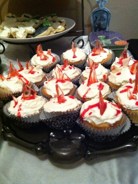 Cupcakes with bloody glass shards as decoration, for a Halloween party.