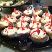 Cupcakes with bloody glass shards as decoration, for a Halloween party.