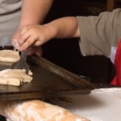 Photo of a kid making cookies.