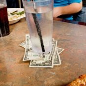 Cash Tip Left UNder Water Glass at Pizza Restaurant