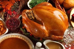 Large Turkey and Side Dishes at Thanksgiving Dinner Table