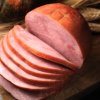 Large Baked Ham Sliced on Cutting Board