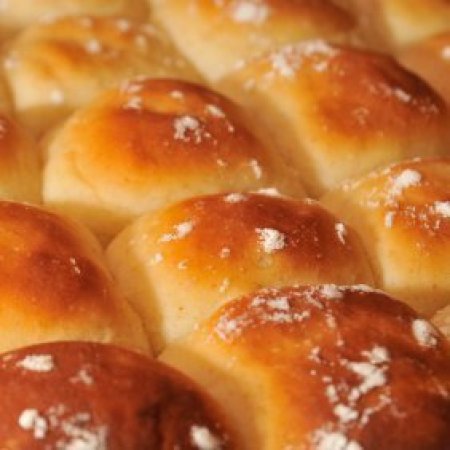 Freshly baked white dinner rolls.