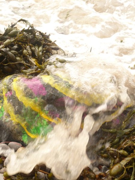 Water Washing over Painted Rocks