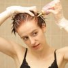A woman dying her own hair.