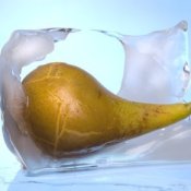 Pear melting out of a block of ice.